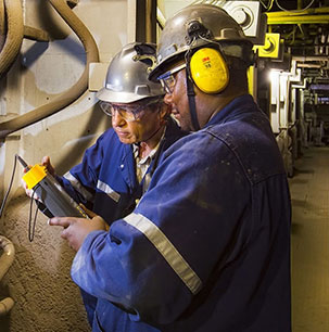 Two persons checking equipments