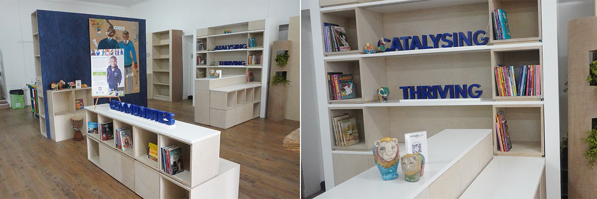 Repurposed stands, into a library and play area