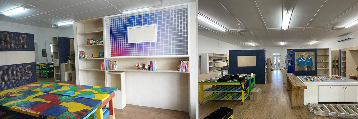 Repurposed stands, into a library and play area